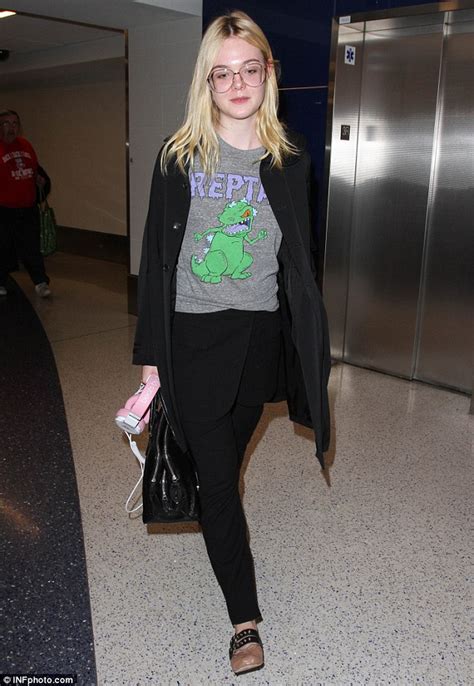 Elle Fanning Wears Unusual Looking Prescription Glasses As She Arrives To Lax Airport Daily