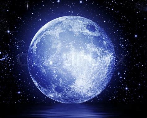 The Full Moon In The Night Sky Reflected In Water Stock Photo Colourbox