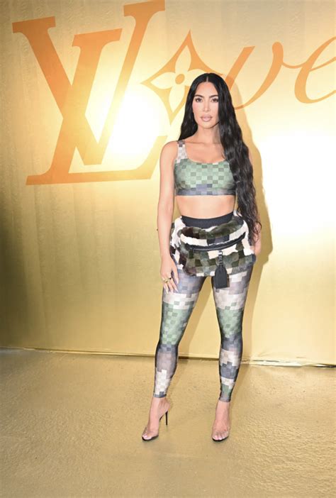 kim kardashian chose a polarizing bag for pharrell s first louis vuitton show