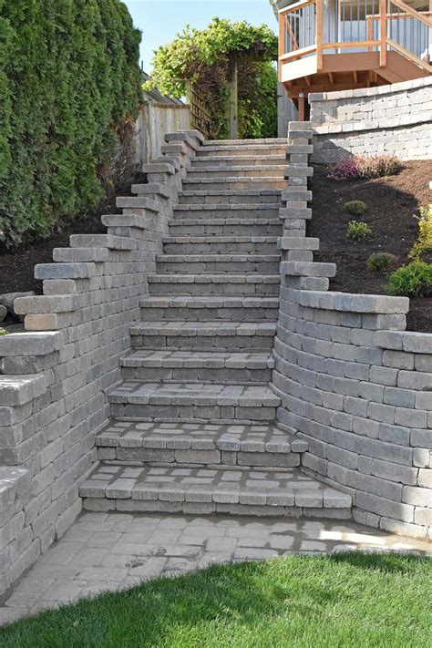 The foundation course is built in a series of steps so that the courses still run in rows, but will step down the hillside. Tiered Retaining Wall on Lake Lawrence Near Yelm - AJB ...