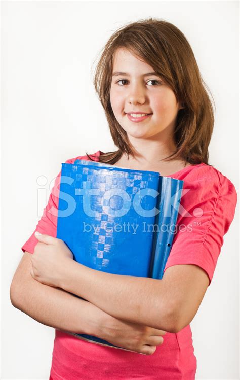 Portrait Of Smiling Teen Girl Holding Books Stock Photo Royalty Free