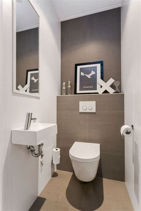 A Neutral Guest Toilet Done In Taupe And White An Artwork A Wall