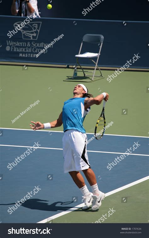 Professional Tennis Player Rafael Nadal Hitting A Serve Stock Photo