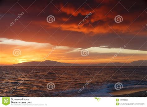 Crimson Sunset On The Shore Of The Orange Sky And Calm Sea Witt Stock