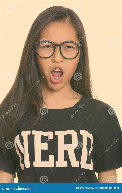 Close Up Of Young Asian Teenage Nerd Girl Looking Angry Stock Image