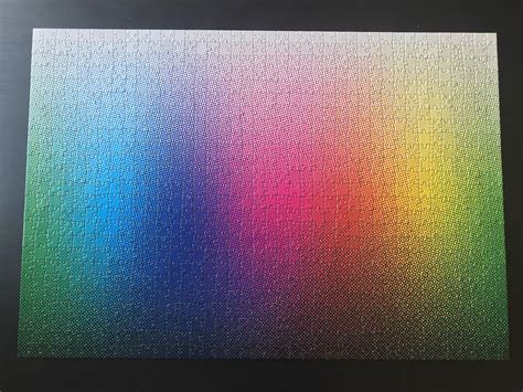 Waves of color cascade across the image as the full spectrum of the rainbow present perceptions of depth and light. Clemens Habicht 1000 Halftone Colours : Jigsawpuzzles