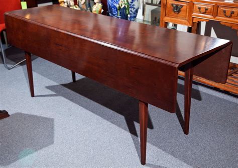 A 48 inch round dining table ensures four people are comfortable during the meal, and a 60 inch dining table provides plenty of room for serving dishes as well as place settings. Cherry Wood Dining Table with Drop leaf at 1stdibs