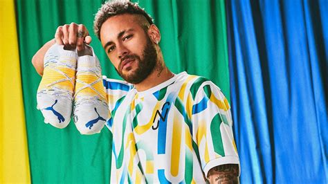 Neymar Da Silva Santos Junior Is Holding Puma Shoes Wearing Colorful