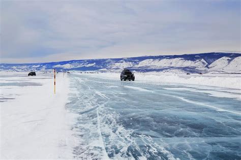 Ice Road On The Frozen Lake Baikal Winter Travel Cars Drive On Ice