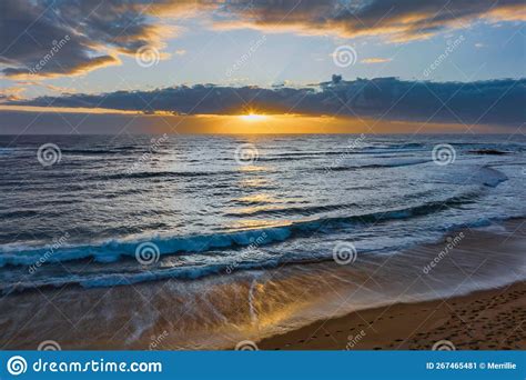 Sunrise Over The Ocean With Clouds And Sunburst Stock Image Image Of