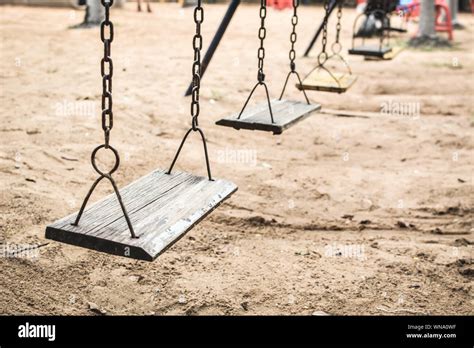 Swings Hanging In Playground Stock Photo Alamy