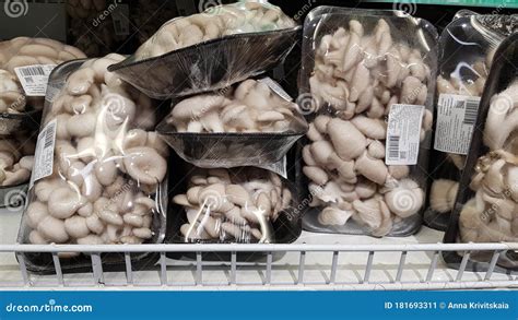 Packages With Fresh Mushrooms For Sale In A Supermarket Editorial Photo