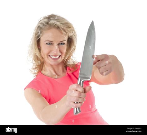 Woman With Knife Testing Blade With Finger Stock Photo Alamy