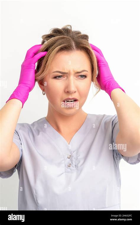 The Emotionally Shocked Young Female Medical Worker Holding Hands On