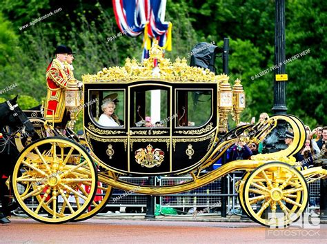 Britains Queen Elizabeth Ii Makes Her Way By Royal Carriage Along The