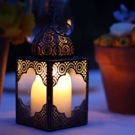 Crafted with an intricate moroccan inspired design, these cylindrical lanterns feature a beautiful brown and antique gold finish. Moroccan Lantern | Moroccan lanterns, Moroccan lamp ...
