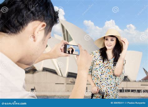 girlfriend a passenger sitting behind female motorcyclist on a motorbike cheerful females