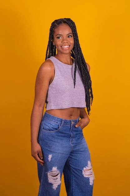 Premium Photo Young Afro Brazilian Woman Smiling Looking At Camera With Braided Hair