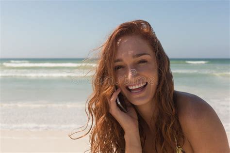 Young Woman In Bikini Talking To Her Mobile Phone At Beach Stock Image