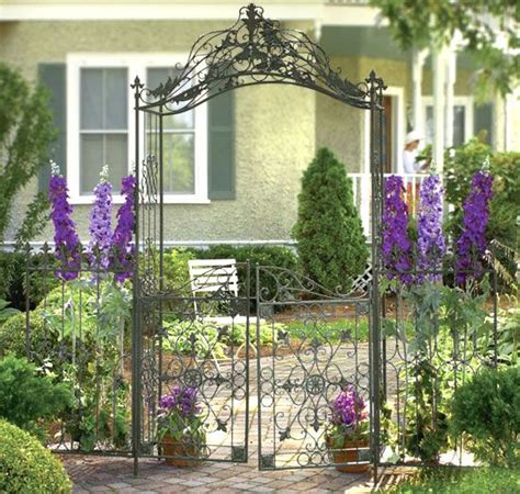 An iron arbor is a captivating way to transition from the outside world into your own little sanctuary. Gated Metal Arbor | Garden gate design, Metal garden gates ...