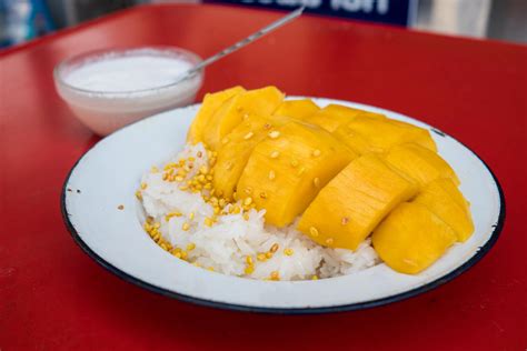 Thai food is famous for their flaming hot dishes, sticky mango rice, and their orange milk tea. Thai Mango Sticky Rice Recipe: Authentic Thai Street Food ...