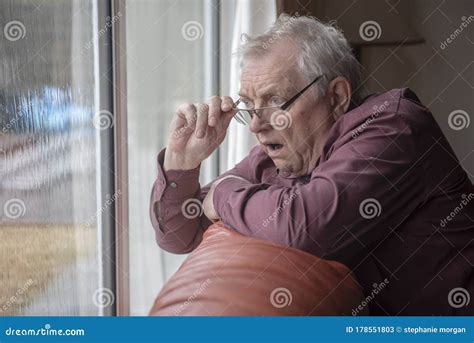 Shocked Senior Man Looking Out Of Window Stock Image Image Of