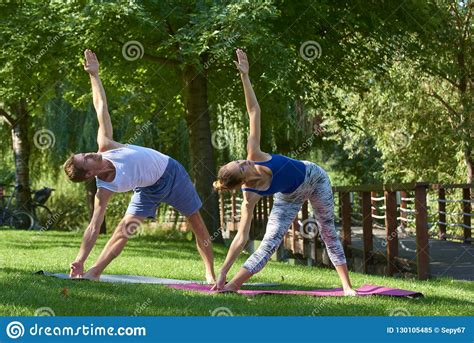 Couple Doing Yoga Together Stock Image Image Of Park 130105485