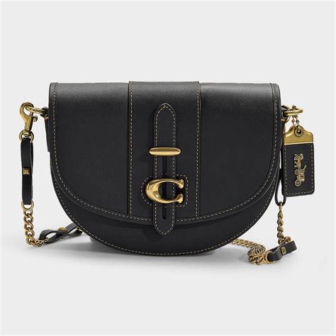 You just need fasten it on the backseat of your bike instead of a shoulder bag on your back, less your burden. COACH Saddle Bag 20 In Black Glovetanned Leather - Lyst