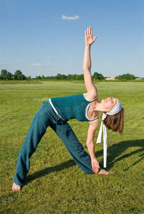Woman Making Yoga Exercises In Top Of A Stone Wall Stock Photo Image