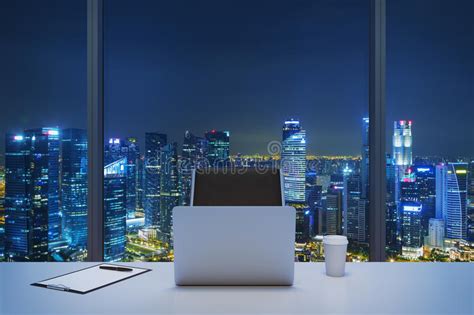 A Workplace In A Modern Panoramic Office With New York Evening View A
