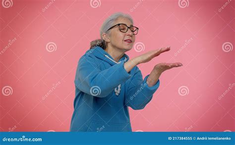 Mature Old Granny Woman Showing Wasting Or Throwing Money Around Hand