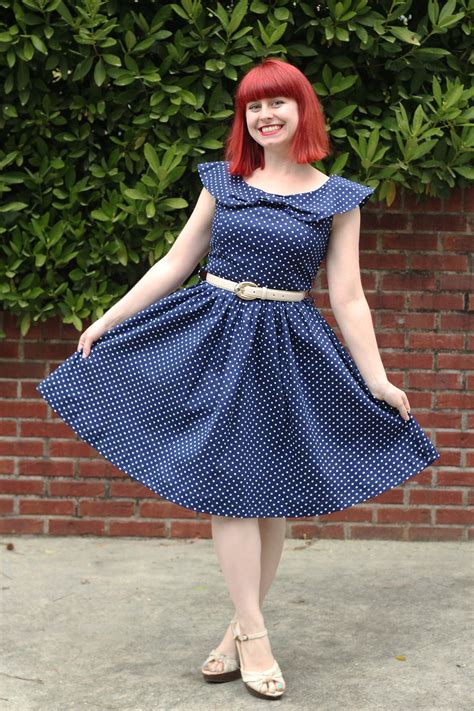Outfit Navy Blue Polka Dot Swing Dress With Off White Belt And Heels
