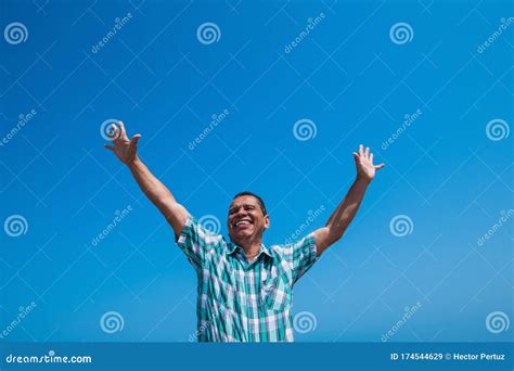 A Happy Man With His Arms In The Air In A Park Retired Concept Stock