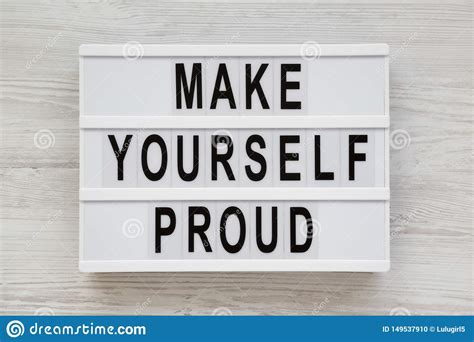 Make Yourself Proud Words On A Lightbox On A White Wooden Background