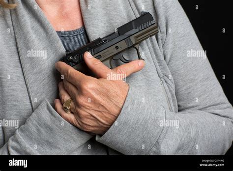 Woman Holding Pistol Hi Res Stock Photography And Images Alamy