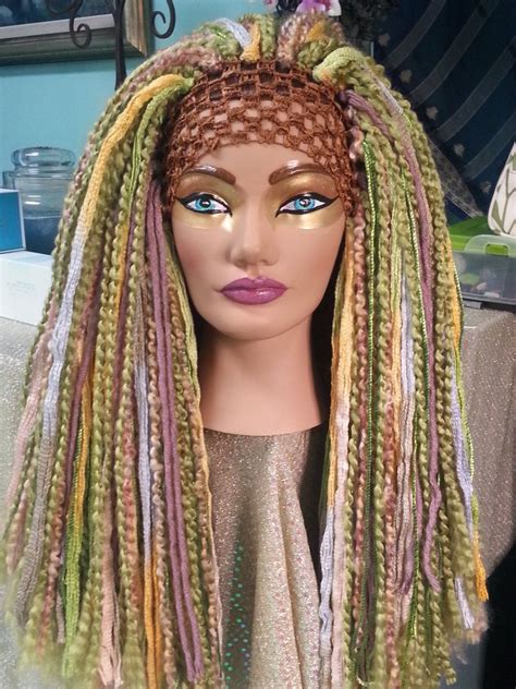 So you want to leave out hair around the edges, so that she can so we're going to part out hair to make our braid, zll the way to the center for this side. Earth Mother Spring Meadow Fairy Nuetral Tones Long Thick Yarn Wig Headdress Hairfall Tribal ...