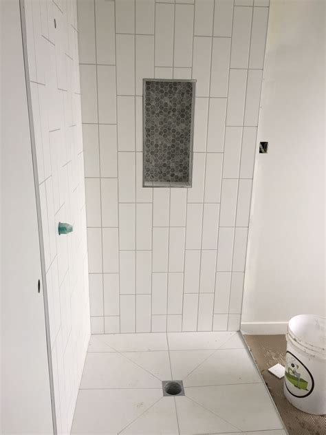 A kitchen backsplash installed beneath a row of cabinetry in one long, narrow area call for complementary horizontal installations of tile, but when your backsplash extends vertically like the one shown here, flipping your subway tile vertically offers a fresh, new aesthetic. Vertical Subway Tile Double Offset with Hexagon inset ...