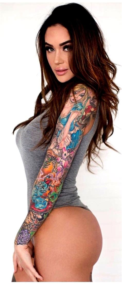 a beautiful woman with tattoos on her arm