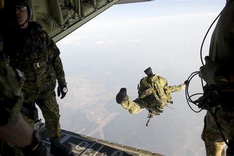 Jumpers From The Canadian Special Operations Regiment Exit A British C