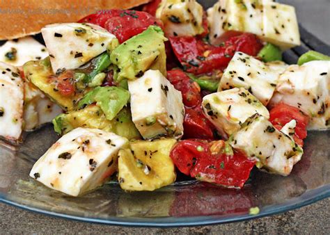 Tomatoes, cucumber, avocado, fresh small mozzarella cheese balls, red onions, and basil pesto dressing. Just a Spoonful of: Avocado / Tomato/ Mozzarella Salad