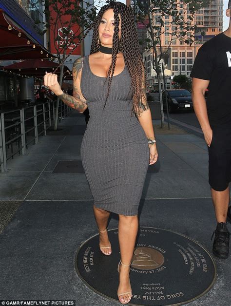 amber rose showcases her wig while flaunting her bountiful curves in tight dress in la daily