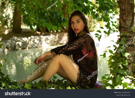 Venezuelan Brunette Girl Bikini Park Leaning Stock Photo