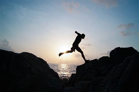 Guy Jumping Off Cliff Stock Photos Pictures And Royalty Free Images Istock