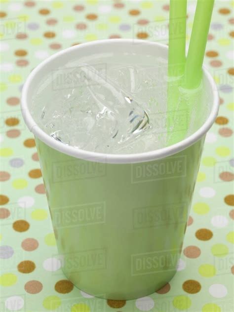 Mineral Water With Ice Cubes In Green Paper Cup Stock Photo Dissolve