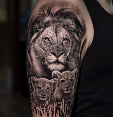 Black And Grey Realistic Lion And Cubs Tattoo By Jose