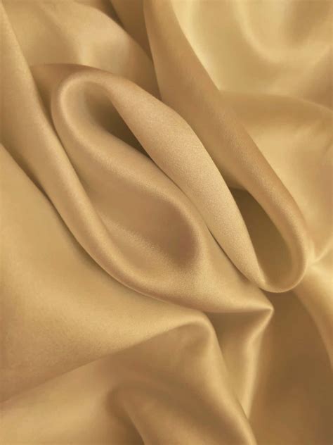 Download A Close Up Of A Beige Silk Fabric Wallpaper