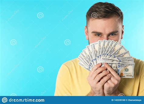 Happy Young Man With Money On Color Background Stock Photo Image Of