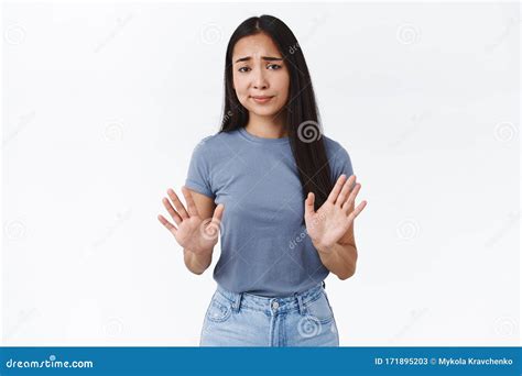 Unamused Arrogant Asian Girl Showing A Hand Gesture Looking Away With Dislike Refusing