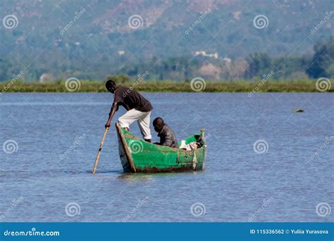 African Fisher Man On The Lake In A Boat Editorial Photography Image