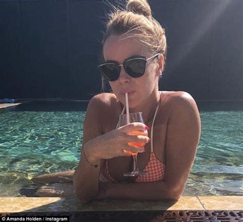 Please note that this page is run and maintained. Amanda Holden shows off her peachy posterior in bikini in ...